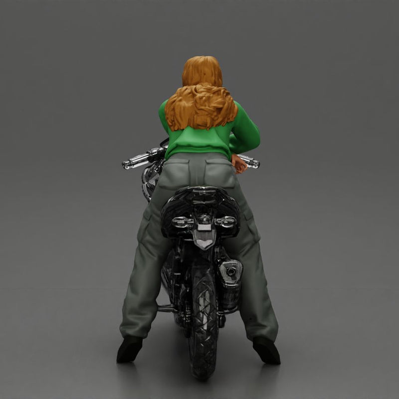 motorcyclist woman hoodie sitting on motorcycle