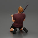 tennis player holding racket sits in celebration of his victory - Only-Games