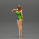 Sexy girl in onepiece standing with her friend on the beach - Only-Games