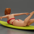 surfer girl with effortless grace, lying on her surfboard as she rides the wave - Only-Games