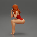 Sexy girl in swimsuit sitting - Only-Games