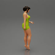Sexy Girl standing in mini dress on the beach - Only-Games