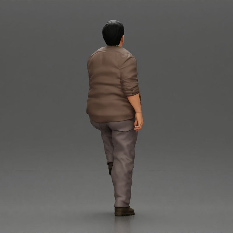 Fat Asian man looking upward in shirt and pants with one leg placed on a step