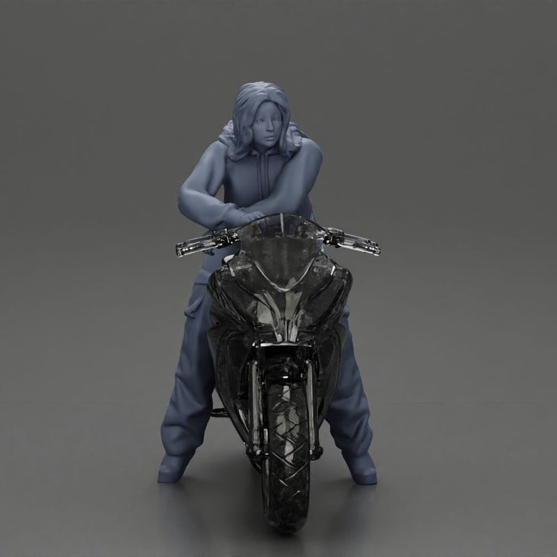 motorcyclist woman hoodie sitting on motorcycle