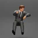 businessman sitting in his car holding steering wheel leaning his left arm on the window - Only-Games