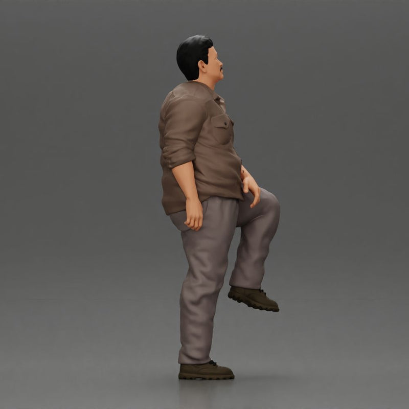 Fat Asian man looking upward in shirt and pants with one leg placed on a step