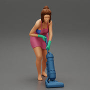 housewife makes home cleaning with a vacuum cleaner - Only-Games