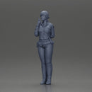 policewoman standing hand resting on her back speaking into a radio with short hair - Only-Games