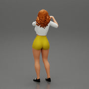 Travel woman in short pointing her next destination using world map - Only-Games