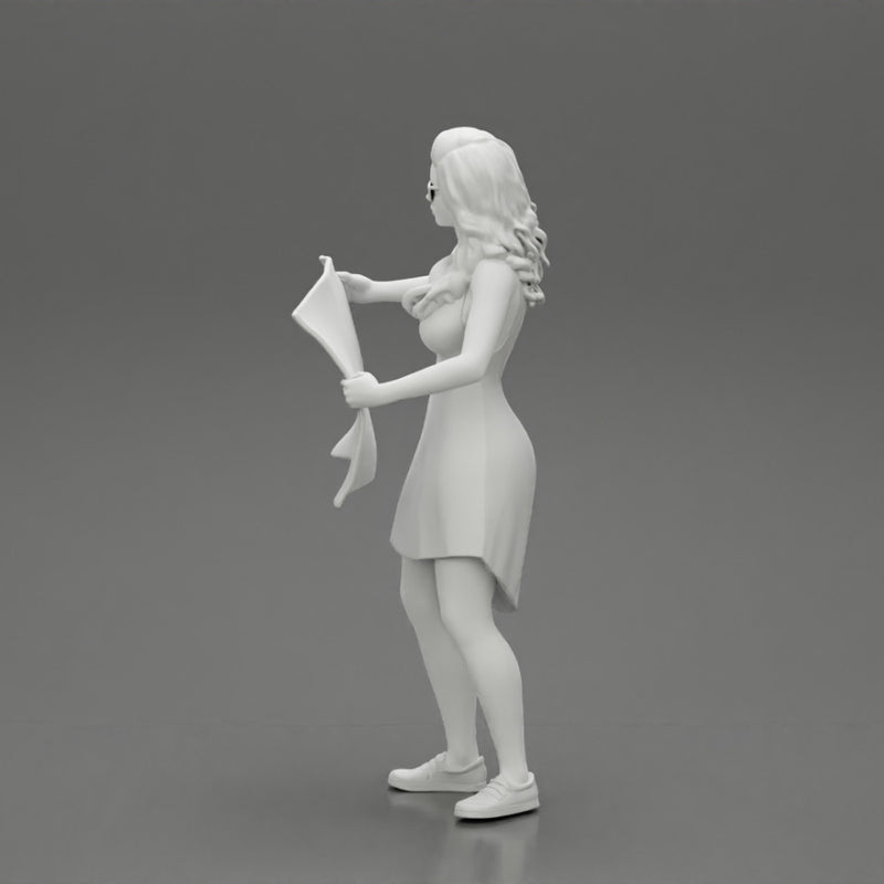 travel woman in dress with sun glasses holding a map and looking to the map - Only-Games