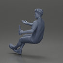 Man in shorts sitting explaining and holding a drink - Only-Games