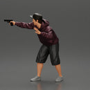 gangster man in a hoodie and cap shooting a gun behind the car - Only-Games