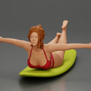 surfer girl with effortless grace, lying on her surfboard as she rides the wave - Only-Games