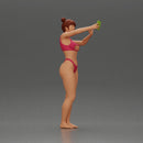 attractive woman in bikini taking a selfie with her phone on the beach - Only-Games