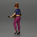 Young woman with short hair standing playing on an acoustic guitar on stage - Only-Games