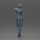 beautiful girl in a mini dress and heels with short hair places her hand on her neck - Only-Games