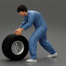Mechanic worker walking and rolling tyre - Only-Games