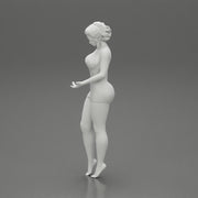 Sexy Girl standing in mini dress on the beach - Only-Games