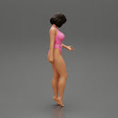 Beautiful girl in onepiece bikini standing on the beach - Only-Games