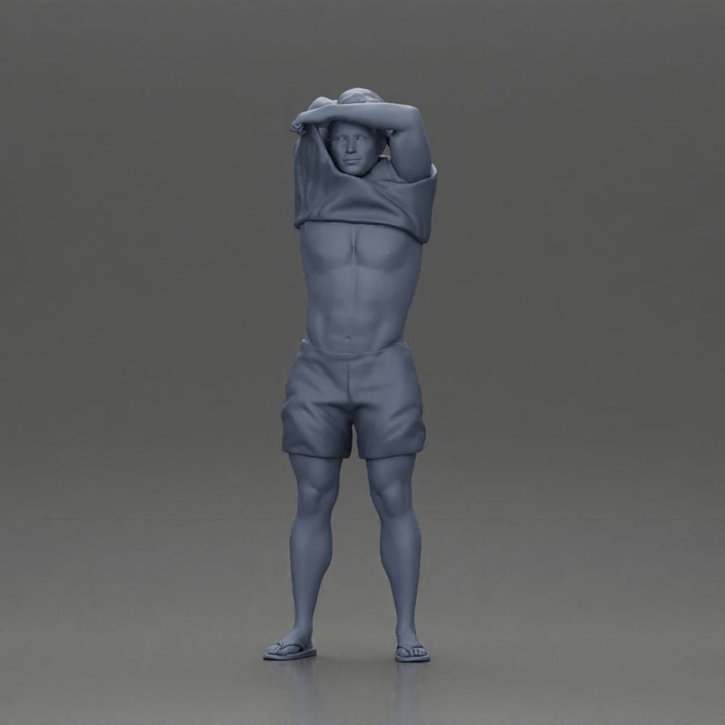 muscular man in shorts taking off his shirt to go swimming - Only-Games