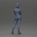 Woman in Orange Dress and Boots Stands Stylishly Confidence With Arms Crossed - Only-Games