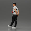 skater man leaning against the wall wearing a cap and banana bag - Only-Games