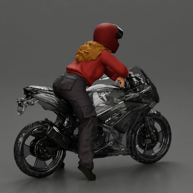 motorcyclist woman in helmet and hoodie sitting on motorcycle