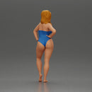 Elegant pose in blue swimsuit showcasing confidence and grace - Only-Games