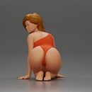 Beautiful Woman in One-Piece Bikini in a Kneeling Pin-Up Pose on the Beach - Only-Games