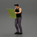 Young Man Holding Map And Looking At It While Standing On The City - Only-Games