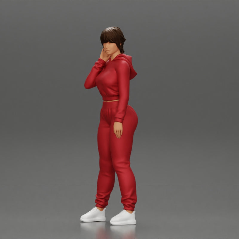 sexy girl in a sports outfit hoodie is standing