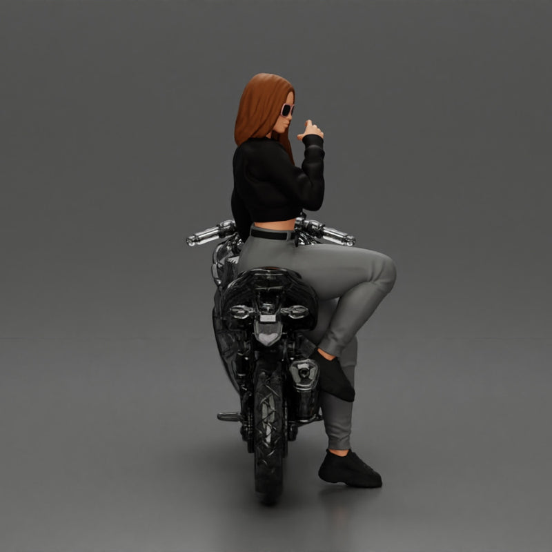 Beautiful girl in sunglasses and  mini jacket sitting on the motorbike