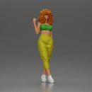 Curly-Haired Woman in Vibrant Green Outfit Striking a Pose - Only-Games