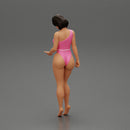 Beautiful girl in onepiece bikini standing on the beach - Only-Games