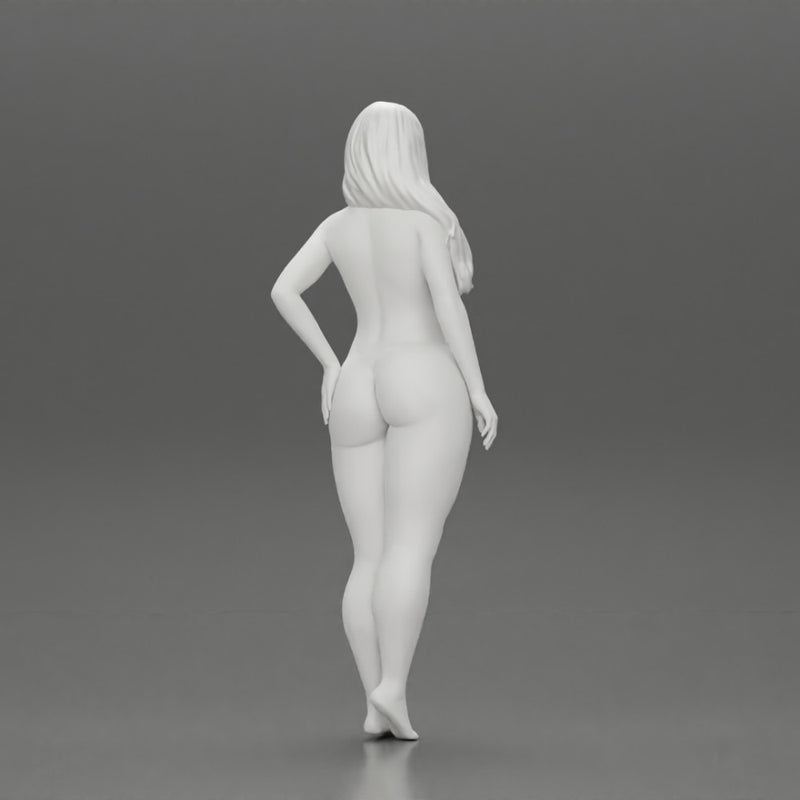 Naked girl standing putting her left hand on her hip