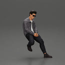 man sitting on a car, wearing a jacket and sunglasses, deep in thought - Only-Games