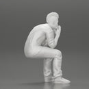 metal man sitting and contemplating with a satanic haircut - Only-Games