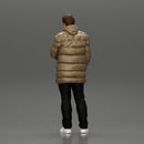 Man in long puffer jacket standing with his hand in his pocket lost in thought - Only-Games