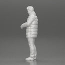 Man in long puffer jacket standing with his hand in his pocket lost in thought - Only-Games