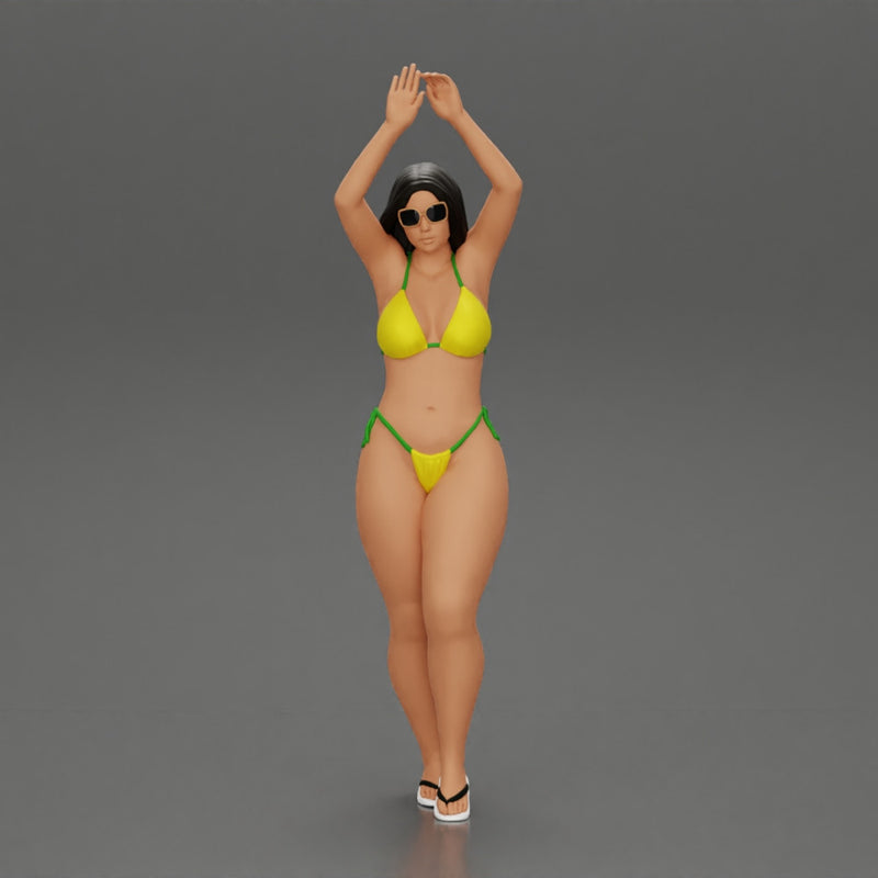 beautiful woman in a bikini with sunglasses standing with her arms raised up on the beach - Only-Games