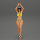 beautiful woman in a bikini with sunglasses standing with her arms raised up on the beach - Only-Games