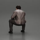 Worried man in a leather jacket sitting and thinking - Only-Games