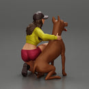 Young woman in a cap and mini jacket sitting and hugging her happy dog - Only-Games