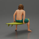 Long-Haired Surfer Sitting on a Surfboard in Calm Ocean Waters, Waiting for the Waves - Only-Games