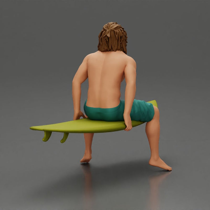 Long-Haired Surfer Sitting on a Surfboard in Calm Ocean Waters, Waiting for the Waves