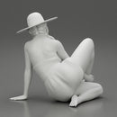 young woman in a summer suit and hat sitting - Only-Games