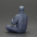 Jamie Farr sitting while eating breakfast in the MASH series - Only-Games