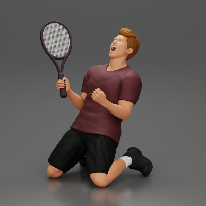 tennis player holding racket sits in celebration of his victory