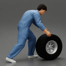 Mechanic worker walking and rolling tyre - Only-Games