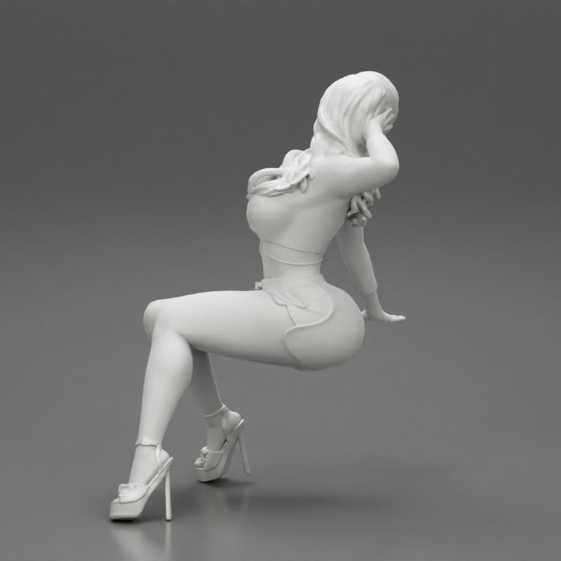 Young sexy girl in shorts with long hair is sitting with one hand in hair - Only-Games